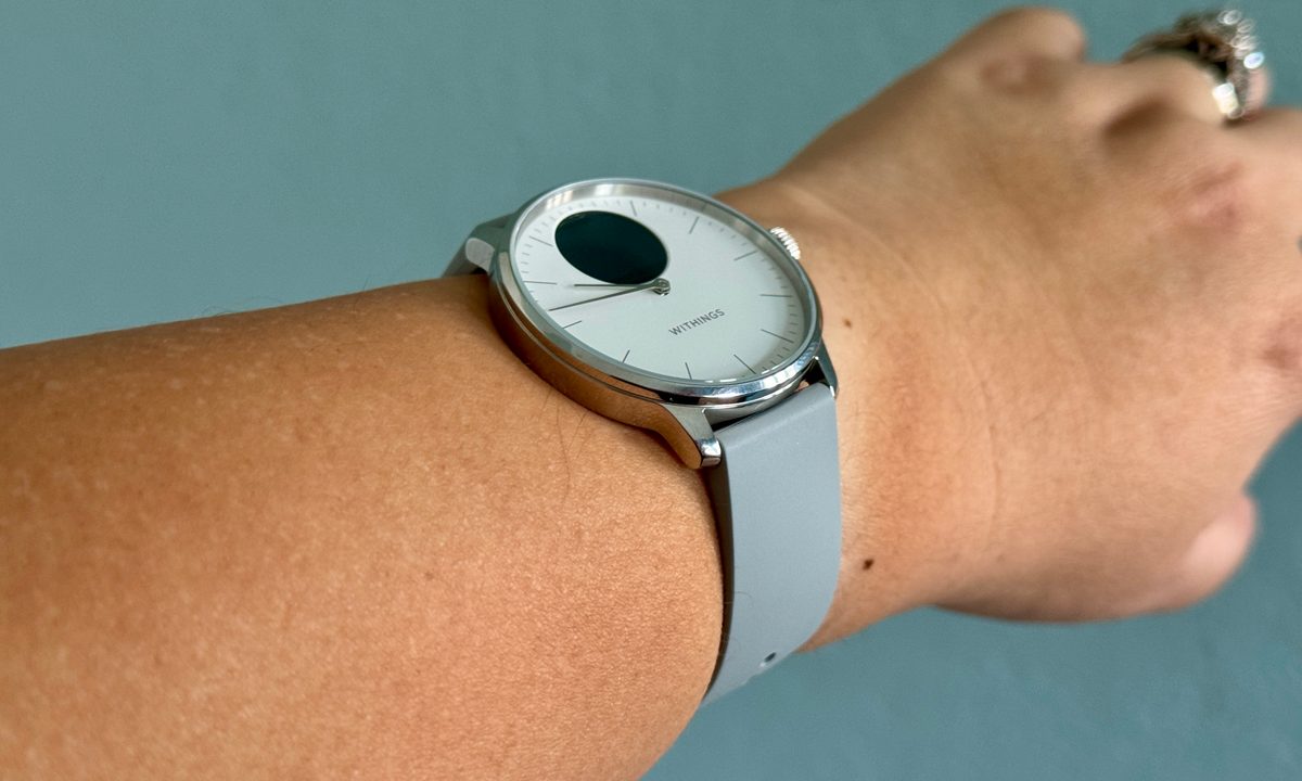 Withings ScanWatch Light being worn on wrist with display off.