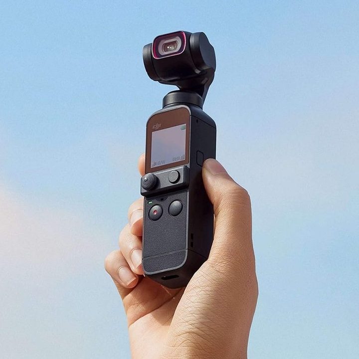 The DJI Pocket 2 handheld 4K camera, held by a person.
