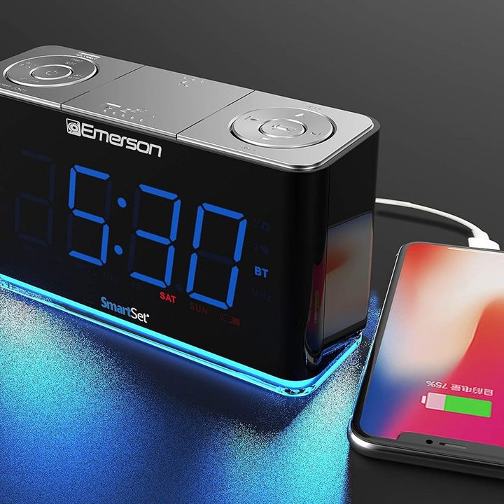 Emerson Smartset Radio Alarm Clock charging a smartphone