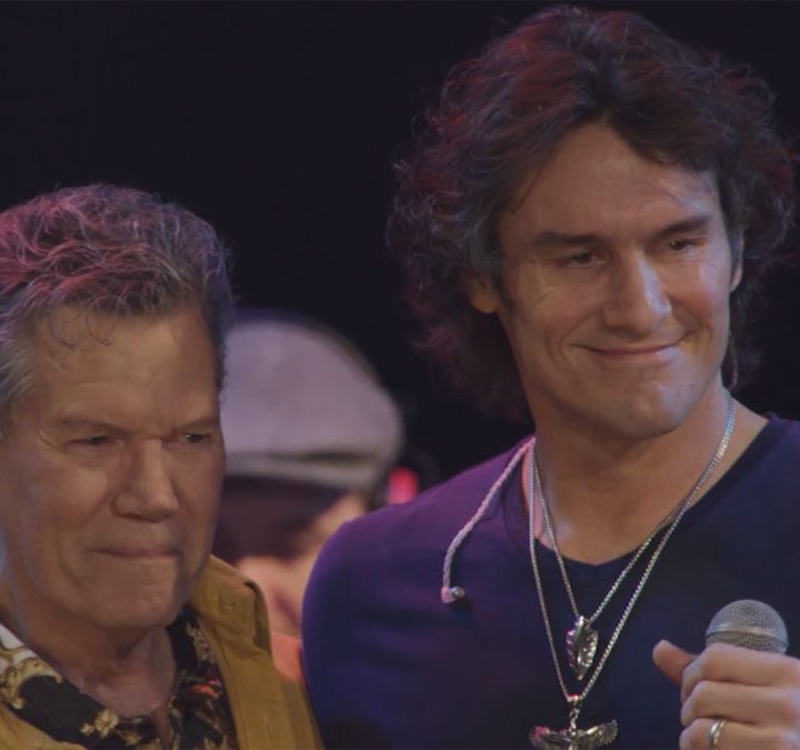 Randy Travis and Joe Nichos smile on stage during Great Performances: George Jones: Still Playin’ Possum.