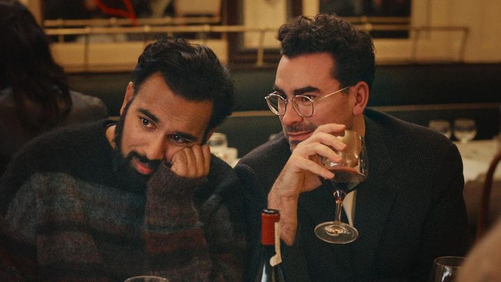 Himesh Pitel and Dan Levy laughing in Netflix's Good Grief