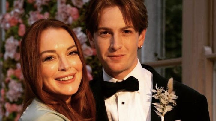 Lindsay and Dakota Lohan smiling for the camera in a BTS shot from Netflix's Irish Wish.