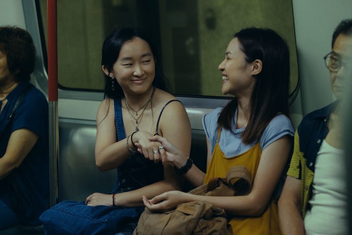 Mercy shakes Charly's hand on a train in Expats.