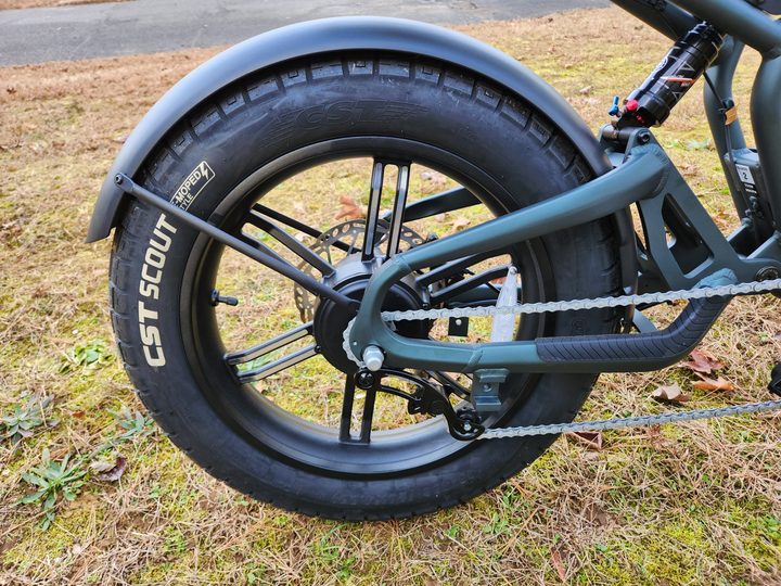 Ride1Up Revv1 right side view of rear wheel showing moped tire, single gearing, fender, and rear shock.