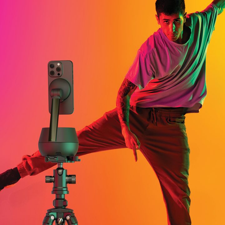 The Belkin Auto-Tracking Stand Pro being used by a dancing man.