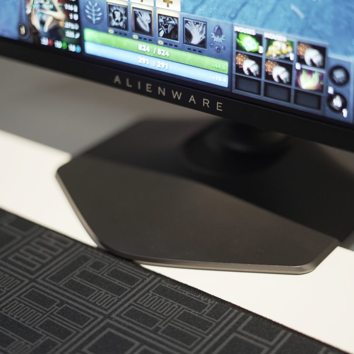 The redesigned base of the Alienware 27 QHD QD-OLED on a table.
