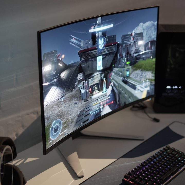 The Alienware 32 4K QD-OLED being played on a white table.