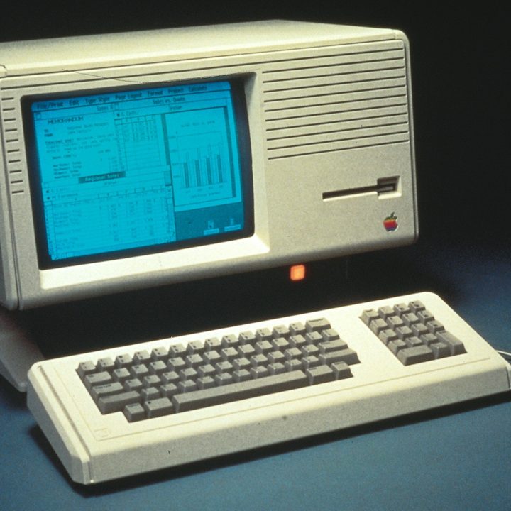 The Apple Lisa computer on a grey background.