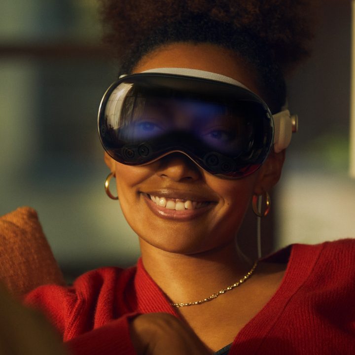 A woman wearing the Apple Vision Pro headset.