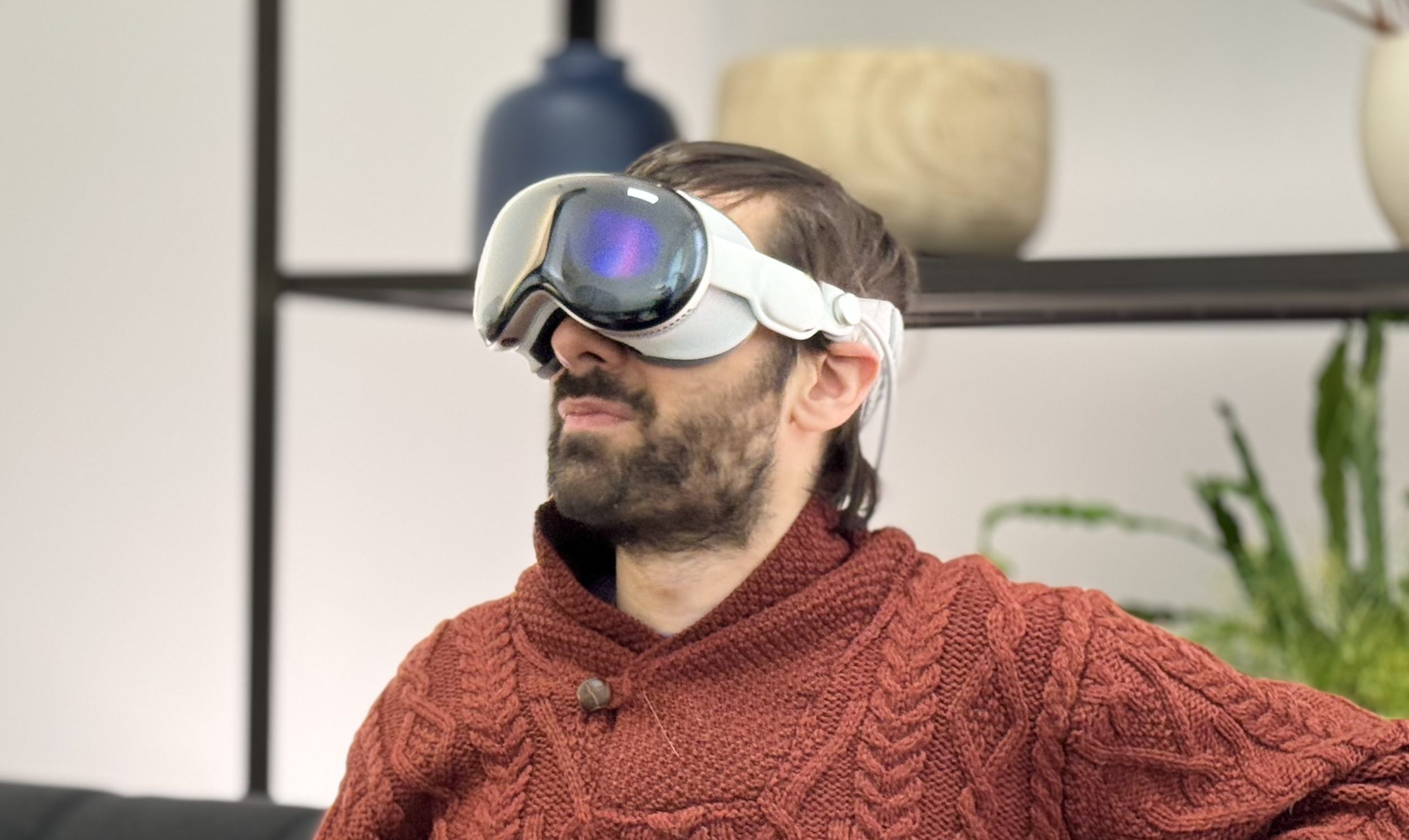 A man wears an Apple Vision Pro headset.