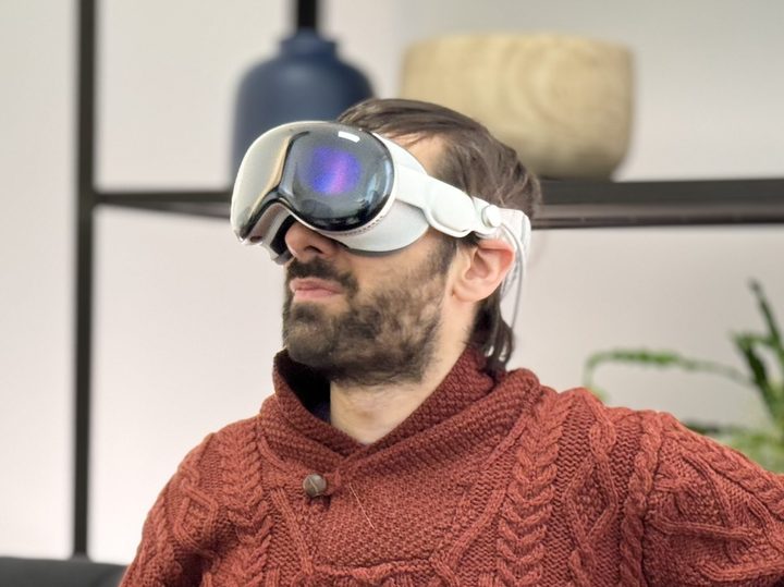 A man wears an Apple Vision Pro headset.