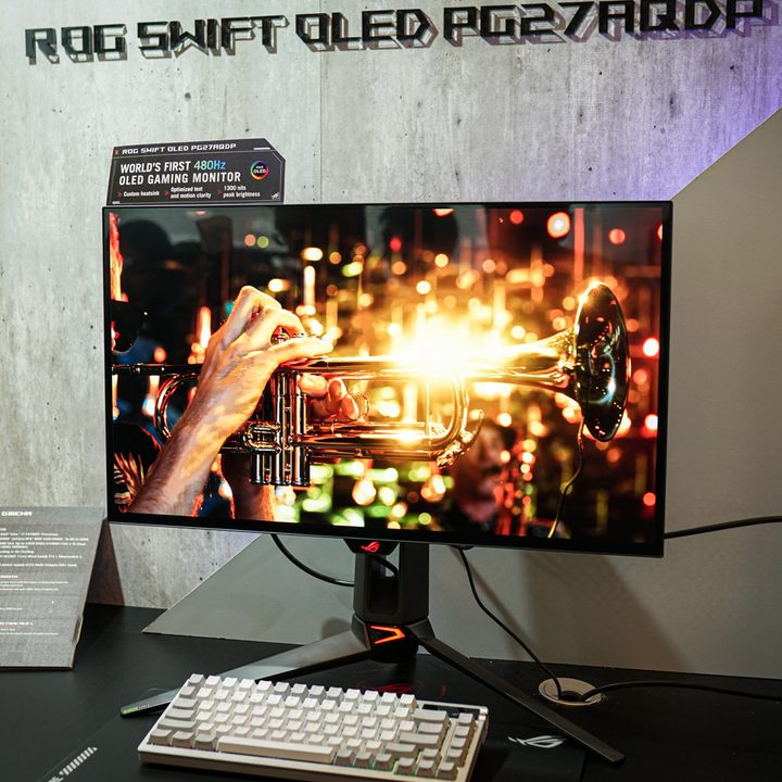 The Asus 480Hz OLED gaming monitor set up at a press event.
