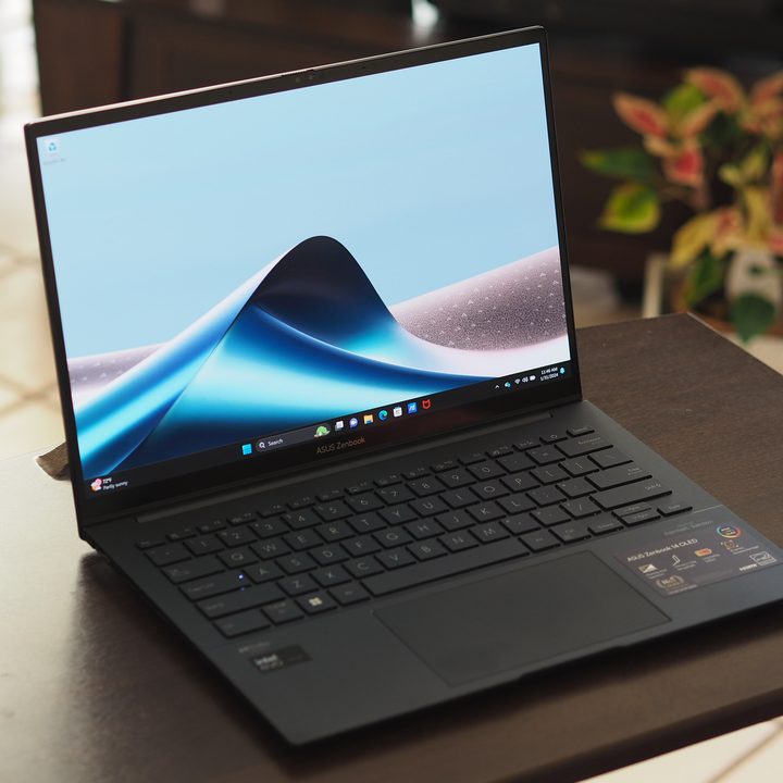 Asus Zenbook 14 OLED 2024 front angled view showing display and keyboard.