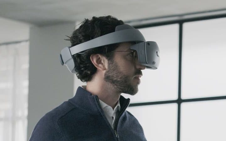 Someone using the Sony mixed-reality headset in front of a window.