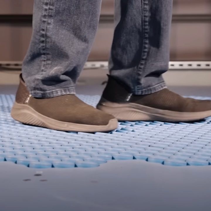 The feet of someone walking on Disney's Holotile technology.