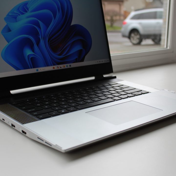 The Framework Laptop 16 in front of a window.