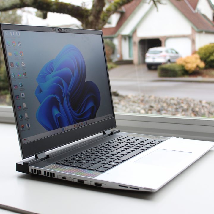 The Framework Laptop 16 in front of a window.