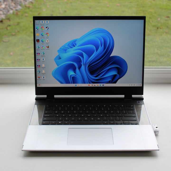 The Framework Laptop 16 in front of a window.