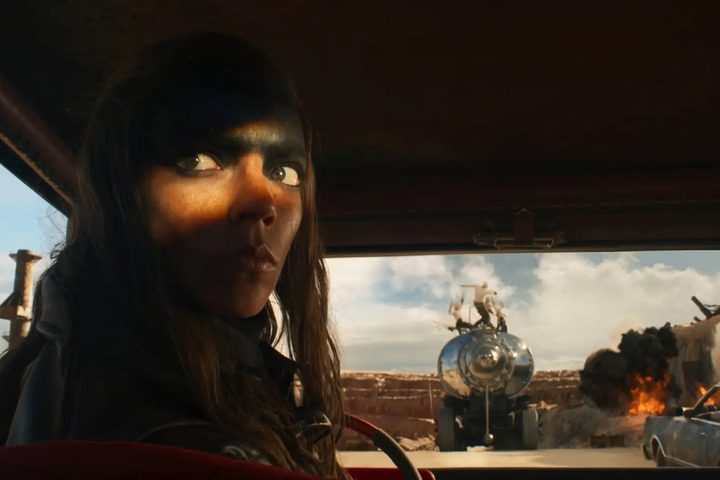 A woman hides in shadow in Furiosa.