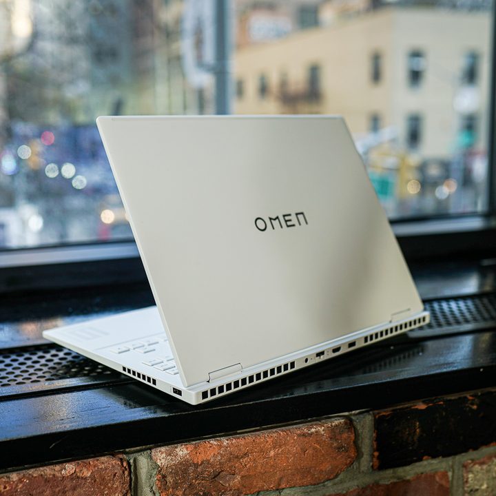 HP Omen Transcend 14 sitting next to a window.