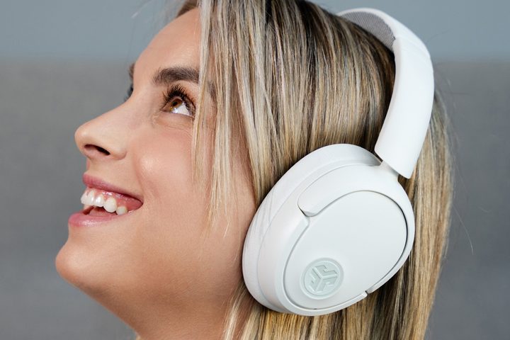 Woman wearing JLab JBuds Lux.