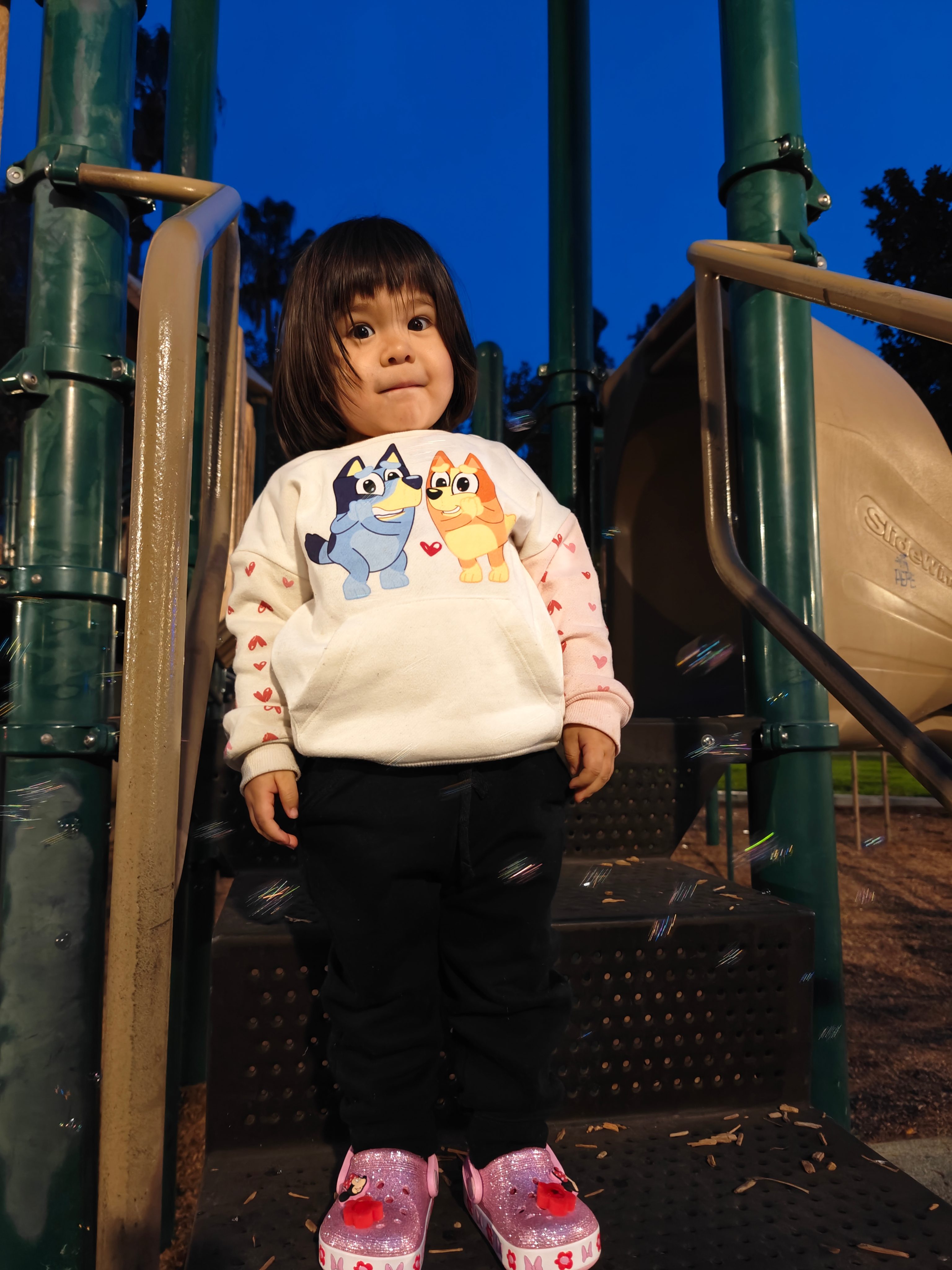 Girl at park taken with OnePlus 12.
