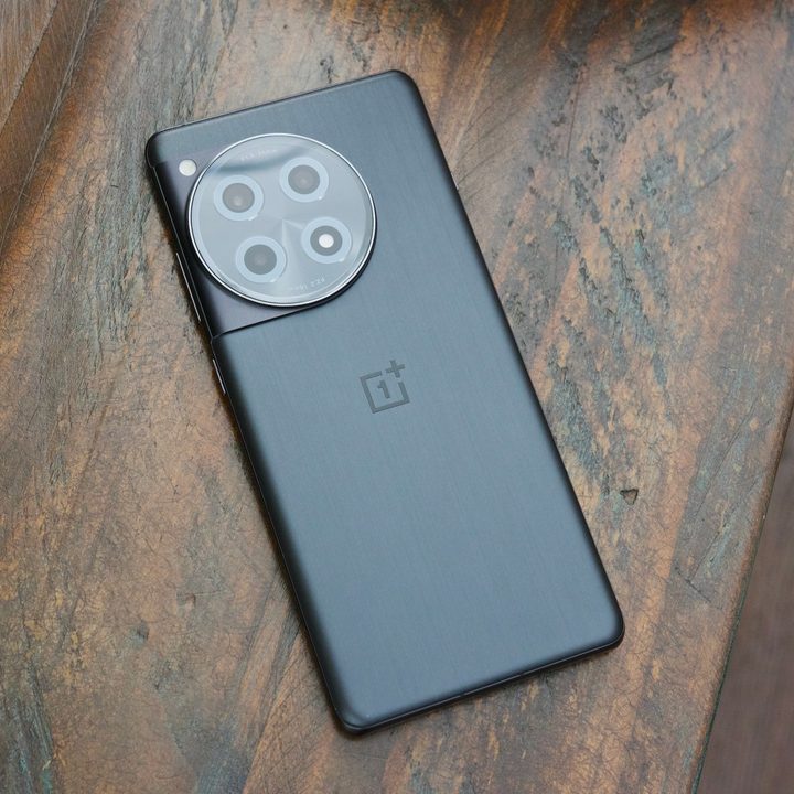 The OnePlus 12R lying on a table.