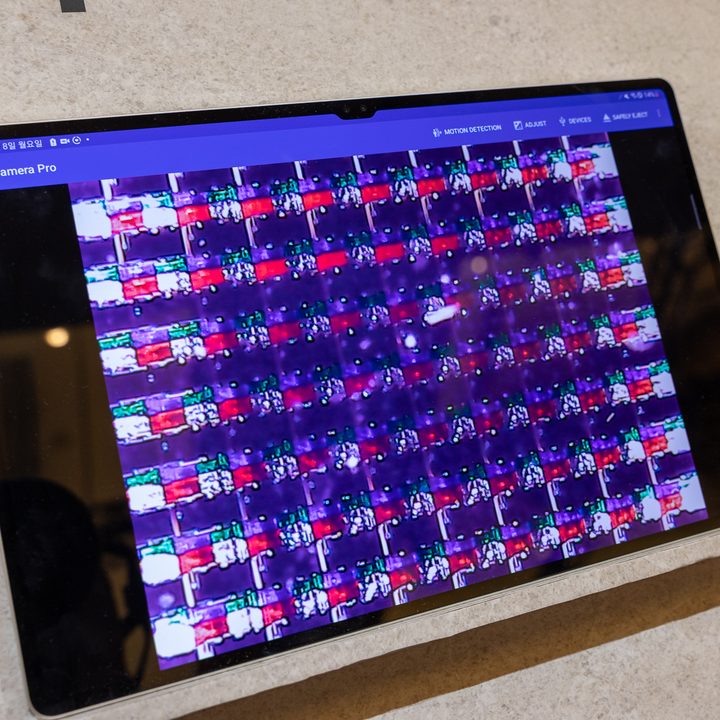 Transparent OLED pixels seen under a microscope.