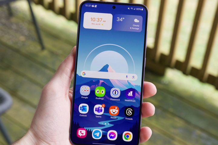 Someone holding the Samsung Galaxy S24 Plus with its screen turned on.