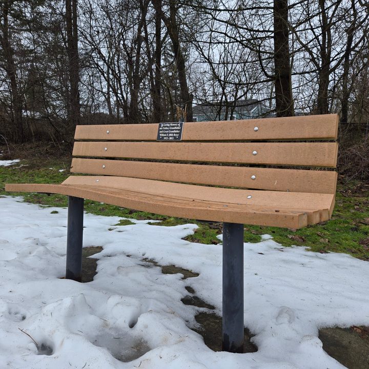 A photo of a bench outside surrounded by snow, taken with the Samsung Galaxy S24 Plus.