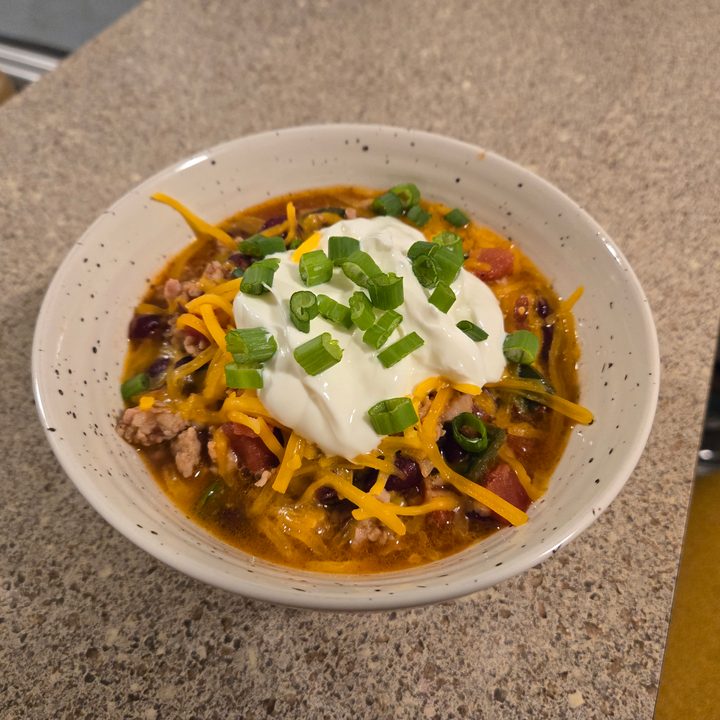 A photo of homemade chili in a tan bowl, taken with the Samsung Galaxy S24 Plus.