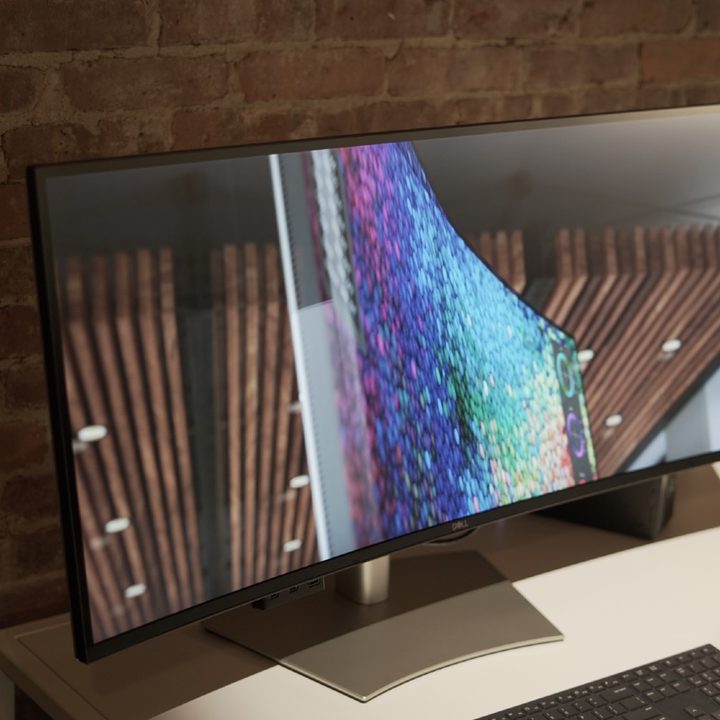 Two Dell UltraSharp monitors on display at an event.