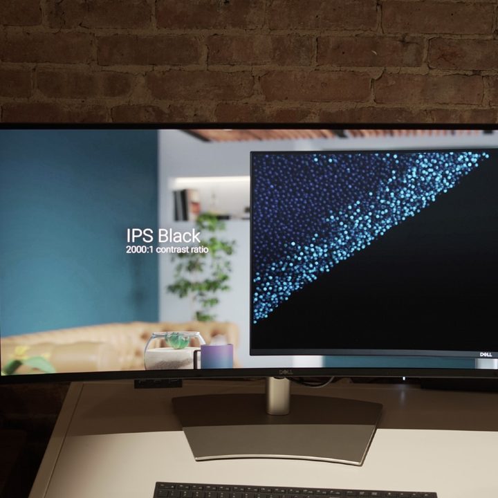 A Dell UltraSharp 5K monitor showing a graphic about IPS Black.