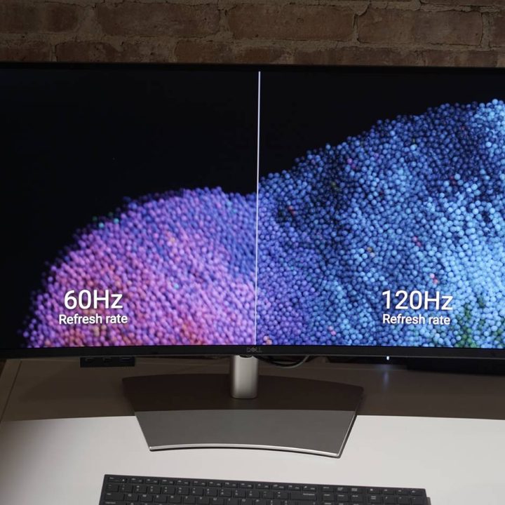 A Dell UltraSharp monitor showing the difference between 60Hz and 120Hz.