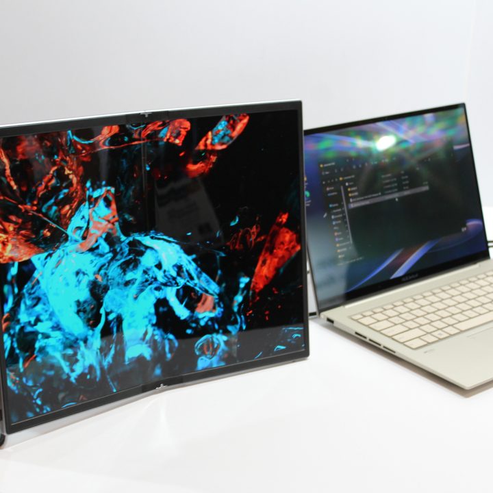 The ZenScreen Fold next to a laptop.