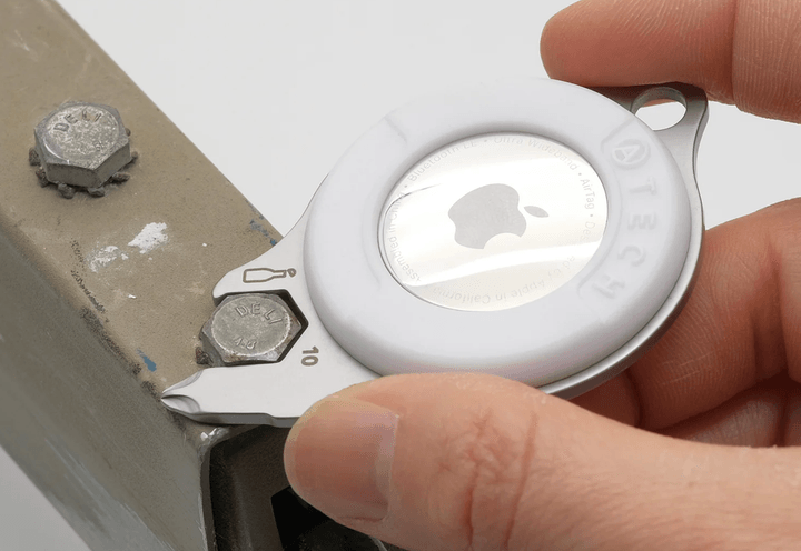 Someone using the AirTag 5-in-1 Cutter Multi-Tool.