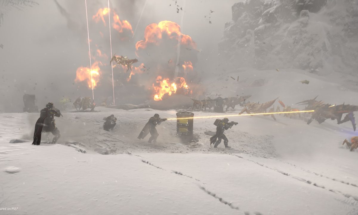 Four soldiers near an airstrike in Helldivers 2.