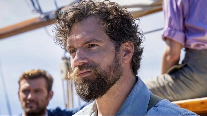 Henry Cavill as Gus March-Phillips looking intently off-camera in The Ministry of Ungeltenmanly Warfare.