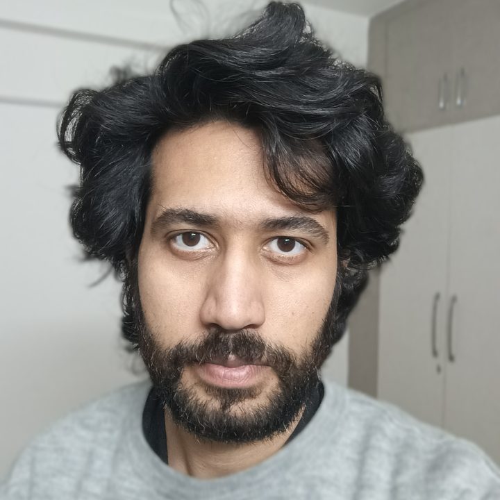 Portrait selfie of a man captured with Blackview N6000 tiny rugged Android phone.