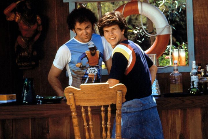 John C. Reilly and Mark Wahlberg stand at a pool bar in Boogie Nights.