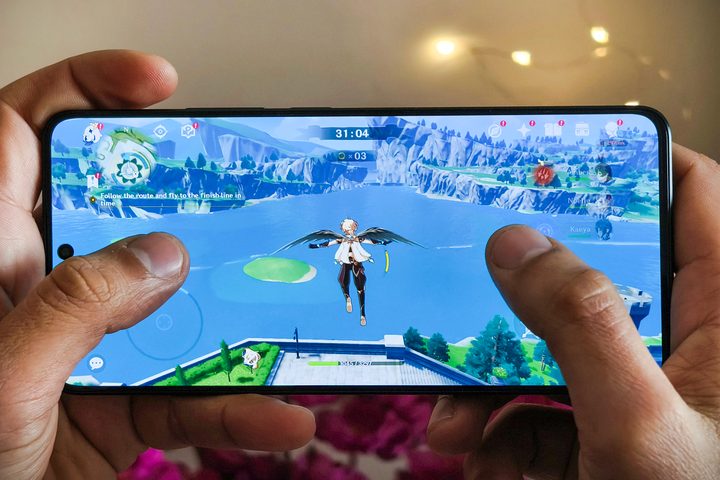Person playing Genshin Impact on POCO X6 Pro.