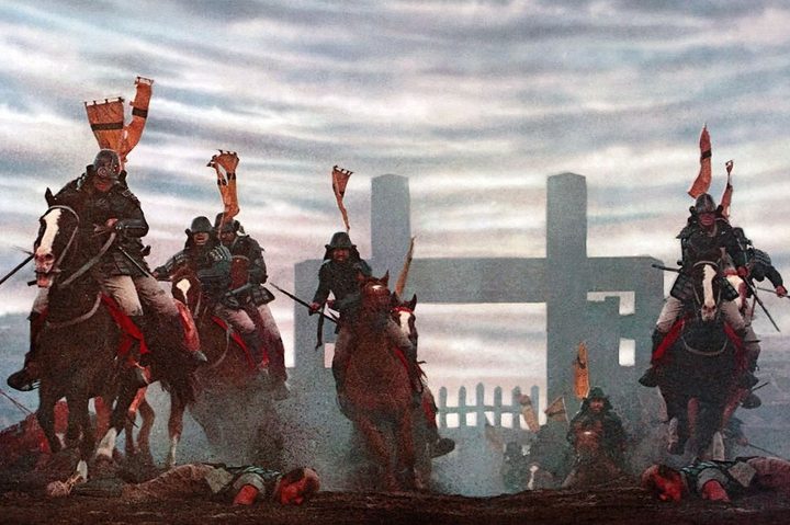 Soldiers ride on horseback over fallen bodies in Ran.