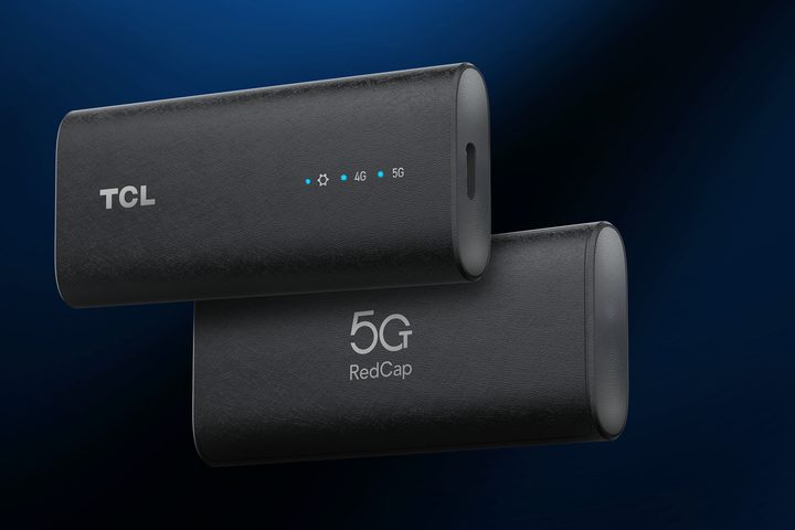 TCL Linkkey IK511 5G Dongle against a blue background.