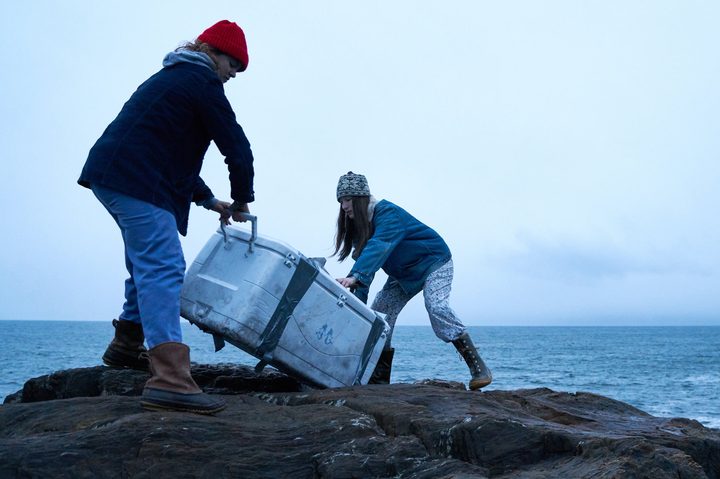 Two sisters carry an ice cooler in Blow the Man Down.
