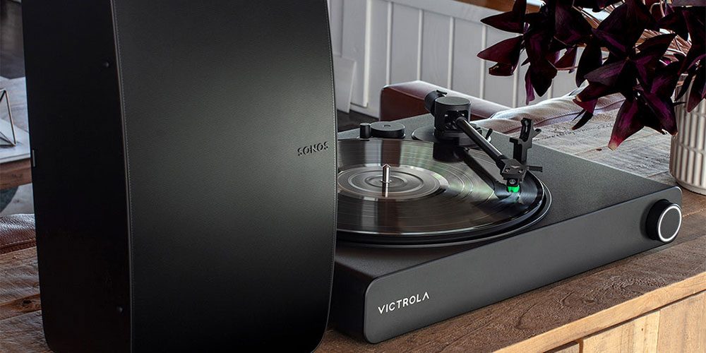 The Victrola Stream Onyx placed next to a Sonos speaker.