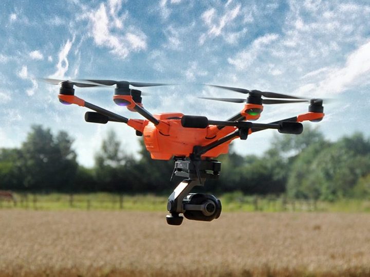 The Yuneec H520E flying above a field.