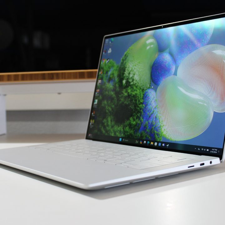 The Dell XPS 14 on a white table with the screen open.