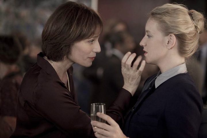 A woman reaches out to another in Love Crime.