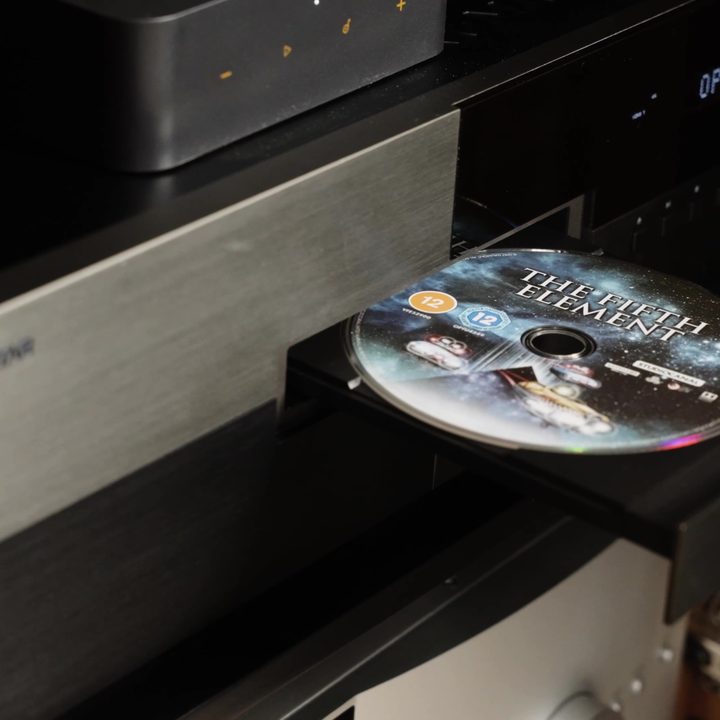 A Blu-ray disc being insterted into a Magnetar Blu-ray player.