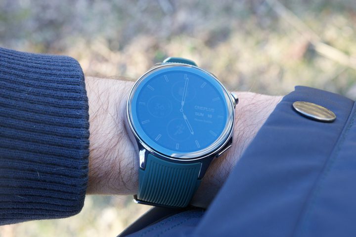 Someone wearing the OnePlus Watch 2, with their hand in a coat pocket.